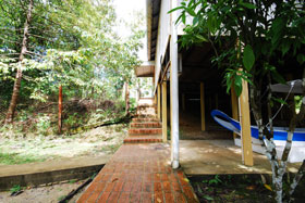 walkway along the bungalow leading to the stream
